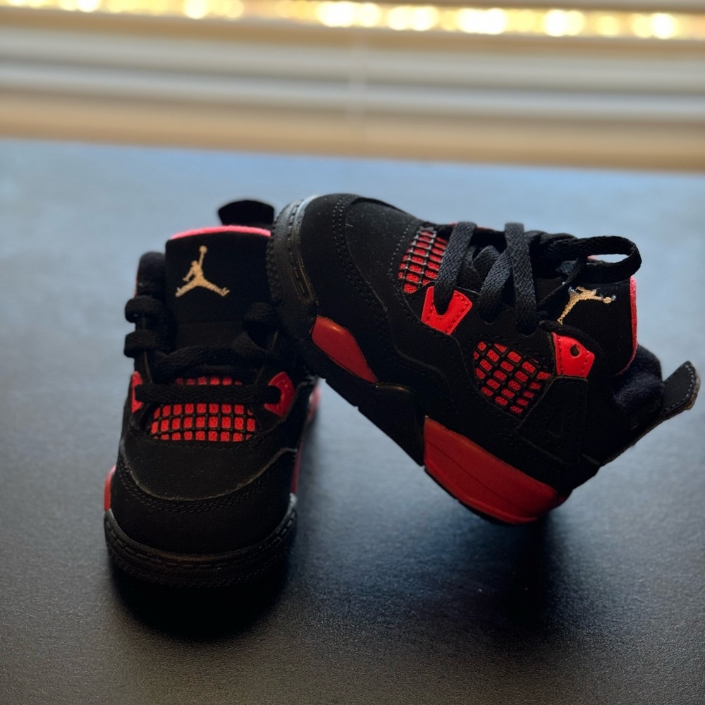 Size 4C 
Worn in good condition 
Red & Black THUNDER 4 Jordans